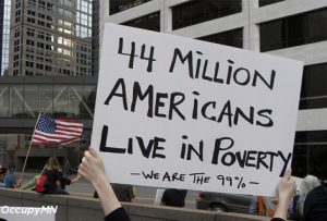 During Occupy protest, a sign with message that 44 Million Americans Live in Poverty.